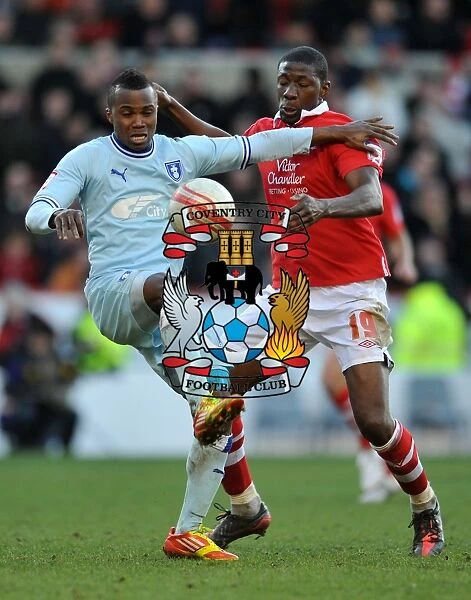 Moussi vs. Nimely: A Championship Showdown - Intense Rivalry between Coventry City's Alex Nimely and Nottingham Forest's Guy Moussi (18-02-2012, City Ground)
