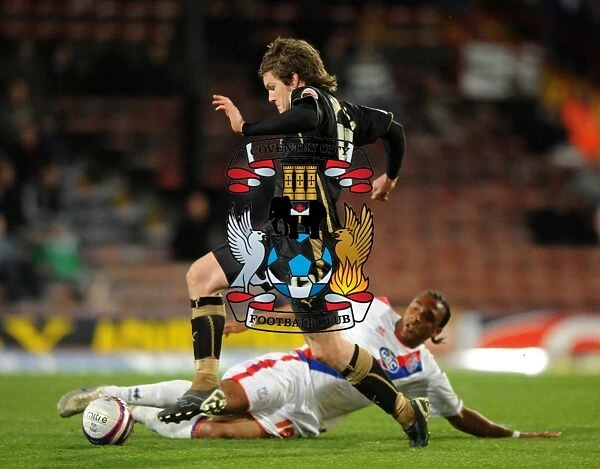 Neil Danns vs. Aron Gunnarsson: Intense Tackle in Coventry City vs. Crystal Palace Championship Match (07-04-2009)