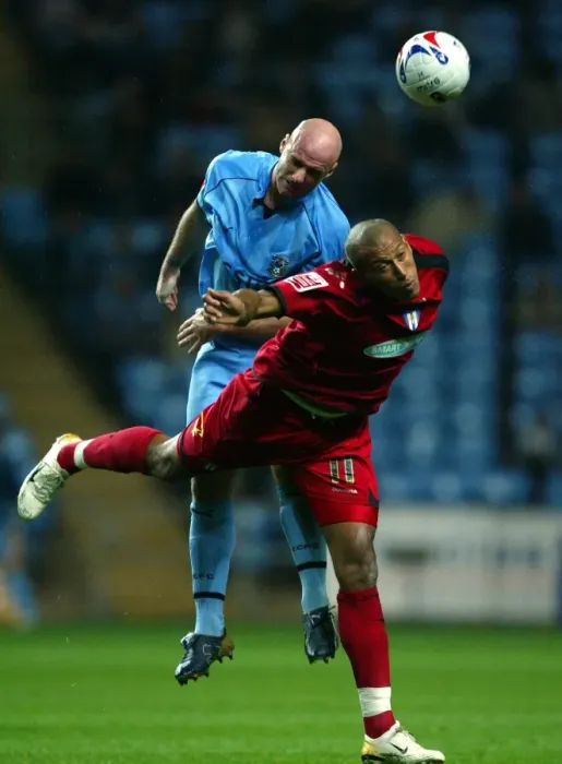 Framed Print : Page vs. Iwelumo: Clash of the Titans at Coventry City vs. Colchester United (23-10-2006) Framed Print : Page vs. Iwelumo: Clash of the Titans at Coventry City vs. Colchester United (23-10-2006)