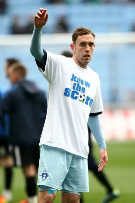 Framed Print : Richard Keogh's Pre-Match Warm-Up with Know the Score T-Shirt (Coventry City vs. Peterborough United, Npower Championship, 07-04-2012, Ricoh Arena)
