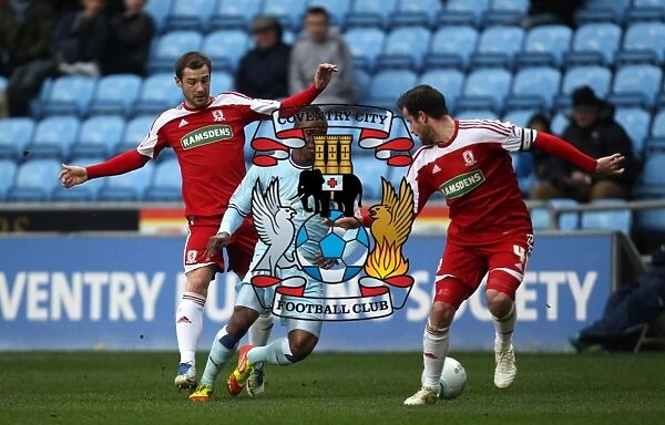 Rivalry's Intense Moment: Nimely vs. Bates Battle for the Ball (Coventry City vs. Middlesbrough, 2012)