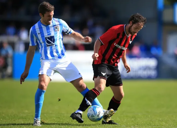 Framed Print : Sam Ricketts vs Danny Hylton: A Battle for the Ball - Coventry City vs Oxford United (Pre-Season Friendly)
