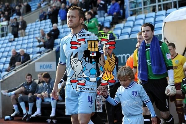 Sammy Clingan and Coventry City Players: Emerging in Unison before the October 2011 Championship Match against Burnley (Ricoh Arena)