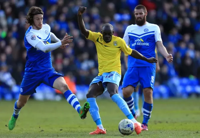 Framed Print : Sanmi Odelusi's Tight Squeeze: Coventry City vs. Peterborough United in Sky Bet League One - Coventry Forward Scores Under Pressure Framed Print : Sanmi Odelusi's Tight Squeeze: Coventry City vs. Peterborough United in Sky Bet League One - Coventry Forward Scores Under Pressure