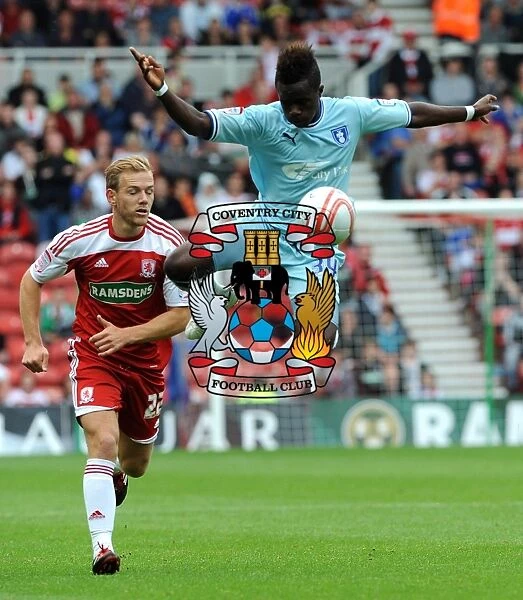 Soaring High: Gael Bigirimana's Aerial Mastery in Coventry City's Championship Battle at Middlesbrough (2011)