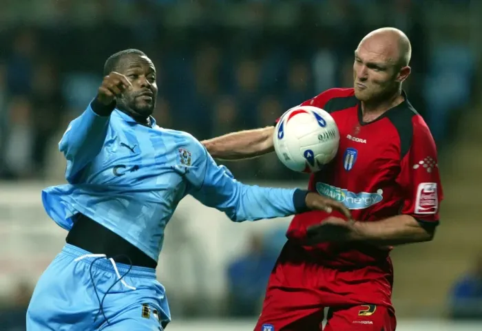 Framed Print : Stern John vs. Wayne Brown: A Riveting Rivalry at Coventry City's Ricoh Arena (October 23, 2006) Framed Print : Stern John vs. Wayne Brown: A Riveting Rivalry at Coventry City's Ricoh Arena (October 23, 2006)