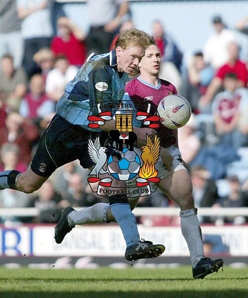 Steve Staunton vs. David Connolly: A Battle for the Ball in Coventry City's Nationwide Division One Clash at Upton Park (17-04-2004)