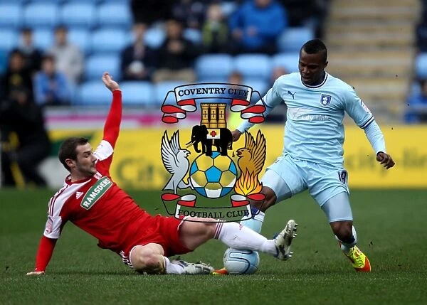 A Tackle in the Npower Championship: Coventry City's Alex Nimely vs Middlesbrough's Kevin Thomson (21-01-2012, Ricoh Arena)