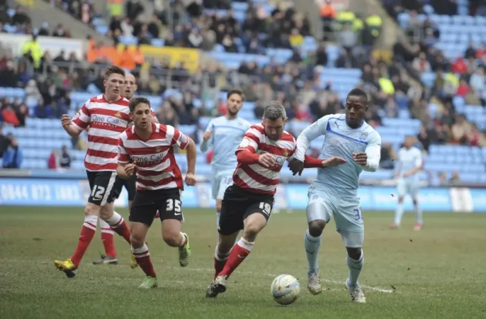 Framed Print : A Tense Clash: Coventry City's Franck Moussa vs Doncaster Rovers Andy Griffin in Npower League One at Ricoh Arena Framed Print : A Tense Clash: Coventry City's Franck Moussa vs Doncaster Rovers Andy Griffin in Npower League One at Ricoh Arena