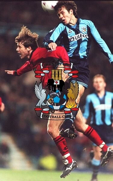 Thrilling Leap: Kenny Cunningham Soars Over Eion Jess in Coventry City vs Wimbledon Clash (Carling Premier League)