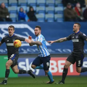 Adam Armstrong Slips Past Bury's Defenders in Coventry City's League One Clash Adam Armstrong Slips Past Bury's Defenders in Coventry City's League One Clash