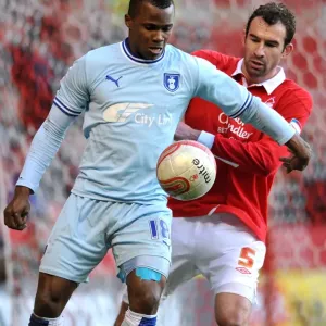 Battle for the Ball: Alex Nimely vs. Danny Higginbotham - Coventry City vs. Nottingham Forest, Npower Championship (2012) Battle for the Ball: Alex Nimely vs. Danny Higginbotham - Coventry City vs. Nottingham Forest, Npower Championship (2012)