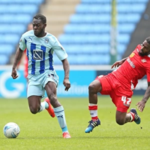 Battle for the Ball: Coventry City vs Crewe Alexandra - Coventry's Frank Nouble and Crewe's Anthony Grant Clash in Sky Bet League One