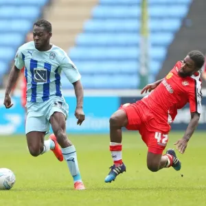 Battle for the Ball: Coventry City vs Crewe Alexandra - Coventry's Frank Nouble and Crewe's Anthony Grant Clash in Sky Bet League One
