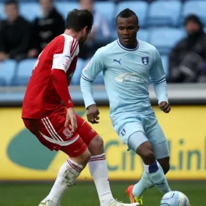 Battle for the Ball: Coventry City vs. Middlesbrough - A Clash Between Alex Nimely and Matthew Bates (Npower Championship, 21-01-2012) Battle for the Ball: Coventry City vs. Middlesbrough - A Clash Between Alex Nimely and Matthew Bates (Npower Championship, 21-01-2012)