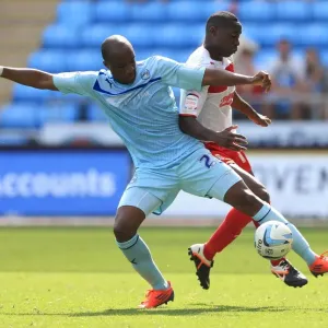 Battle for the Ball: Coventry City vs. Stevenage in Npower League One - Edjenguele vs. Akins Battle for the Ball: Coventry City vs. Stevenage in Npower League One - Edjenguele vs. Akins