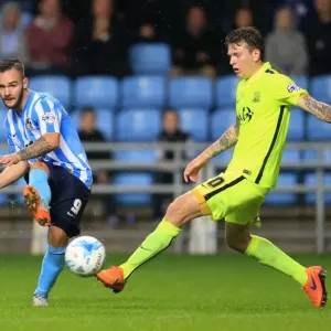 Battle for the Ball: Coventry City's Armstrong vs. Southend's Rea Battle for the Ball: Coventry City's Armstrong vs. Southend's Rea