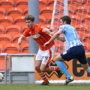 Battle for the Ball: Higham vs. Ricketts in Sky Bet League One Clash between Blackpool and Coventry City (2015-16) Battle for the Ball: Higham vs. Ricketts in Sky Bet League One Clash between Blackpool and Coventry City (2015-16)
