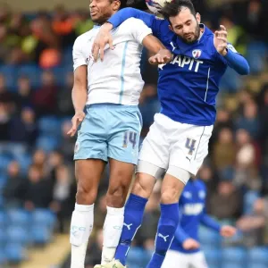 Battle for the Ball: Hird vs. Samuel in Sky Bet League One Clash at Proact Stadium Battle for the Ball: Hird vs. Samuel in Sky Bet League One Clash at Proact Stadium