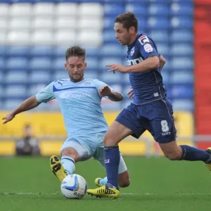 Battle for the Ball: James Bailey vs. Dean Furman - Coventry City vs. Oldham Athletic Battle for the Ball: James Bailey vs. Dean Furman - Coventry City vs. Oldham Athletic