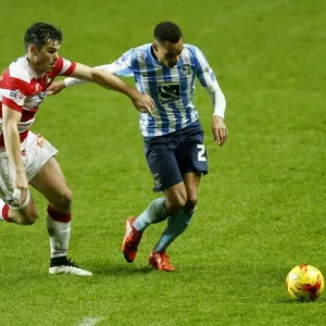 Battle for the Ball: Murphy vs. Middleton in Coventry City's Sky Bet League One Clash against Doncaster Rovers Battle for the Ball: Murphy vs. Middleton in Coventry City's Sky Bet League One Clash against Doncaster Rovers