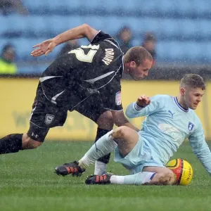 Battle for the Ball: Norwood vs. Drury in Coventry City vs. Ipswich Town Championship Clash Battle for the Ball: Norwood vs. Drury in Coventry City vs. Ipswich Town Championship Clash