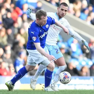 Battle for the Ball: Ritchie Humphries vs. Marcus Tudgay - Sky Bet League One Clash at Chesterfield's Proact Stadium Battle for the Ball: Ritchie Humphries vs. Marcus Tudgay - Sky Bet League One Clash at Chesterfield's Proact Stadium