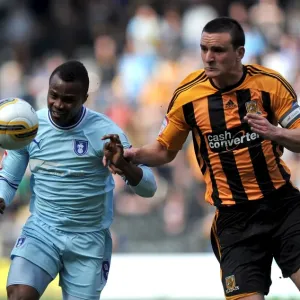 Battle for the Ball: Tchuimeni-Nimely vs. Hobbs at KC Stadium (Coventry City vs. Hull City, Npower Football League Championship, 31-03-2012) Battle for the Ball: Tchuimeni-Nimely vs. Hobbs at KC Stadium (Coventry City vs. Hull City, Npower Football League Championship, 31-03-2012)