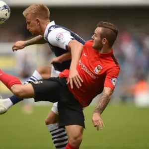 Battle for the Ball: Webster vs. Armstrong - Intense Rivalry in Sky Bet League One: Millwall vs. Coventry City Battle for the Ball: Webster vs. Armstrong - Intense Rivalry in Sky Bet League One: Millwall vs. Coventry City