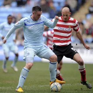 Battle in Football League One: Coventry City vs Doncaster Rovers at Ricoh Arena - Callum Ball vs Rob Jones Battle in Football League One: Coventry City vs Doncaster Rovers at Ricoh Arena - Callum Ball vs Rob Jones