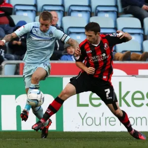 Battle for Possession: Coventry City vs Bournemouth in Football League One at Ricoh Arena Battle for Possession: Coventry City vs Bournemouth in Football League One at Ricoh Arena