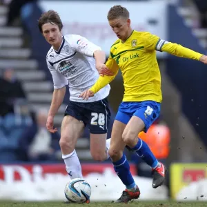 Battling for Possession: Davies vs. Baker in Preston North End vs. Coventry City Battling for Possession: Davies vs. Baker in Preston North End vs. Coventry City