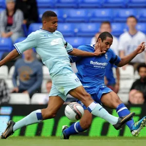 Birmingham City vs Coventry City: Intense Battle for the Ball - Cyrus Christie vs Jean Beausejour