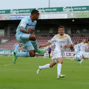 Callum Wilson Sends a Soaring Cross at Sixfields Stadium during Coventry City vs Colchester United (Sky Bet Football League One, 2013) Callum Wilson Sends a Soaring Cross at Sixfields Stadium during Coventry City vs Colchester United (Sky Bet Football League One, 2013)