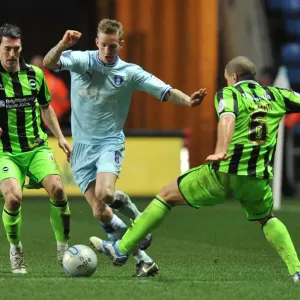 Carl Baker Evades Taricco and El-Abd: Coventry City vs Brighton & Hove Albion in Npower Championship Action Carl Baker Evades Taricco and El-Abd: Coventry City vs Brighton & Hove Albion in Npower Championship Action