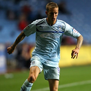 Carl Baker Fights for Coventry City in Intense Capital One Cup Clash vs. Birmingham City at Ricoh Arena