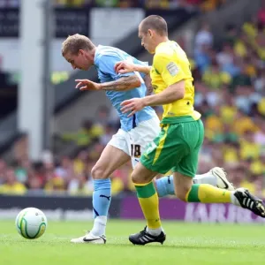 Carl Baker vs. Andrew Crofts: Intense Battle for Ball Possession in Coventry City vs. Norwich City Championship Clash (07-05-2011) Carl Baker vs. Andrew Crofts: Intense Battle for Ball Possession in Coventry City vs. Norwich City Championship Clash (07-05-2011)