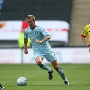 Carl Baker vs. Watford Defender: Intense Tackle in Coventry City's Npower Championship Match (August 20, 2011, Ricoh Arena) Carl Baker vs. Watford Defender: Intense Tackle in Coventry City's Npower Championship Match (August 20, 2011, Ricoh Arena)