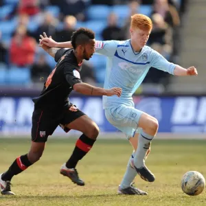 Challenge at Ricoh Arena: Coventry City's Shaleum Logan vs. Brentford's Ryan Haynes, Football League One, 2013 Challenge at Ricoh Arena: Coventry City's Shaleum Logan vs. Brentford's Ryan Haynes, Football League One, 2013