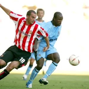 Clash at Highfield Road: A Battle Between Coventry City's Ben Clark and Sunderland's Patrick Suffo (07-08-2004) Clash at Highfield Road: A Battle Between Coventry City's Ben Clark and Sunderland's Patrick Suffo (07-08-2004)