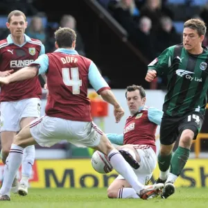 Cody McDonald's Fierce Battle Against Burnley's Defenders: Coventry City vs Burnley, Championship Clash at Turf Moor Cody McDonald's Fierce Battle Against Burnley's Defenders: Coventry City vs Burnley, Championship Clash at Turf Moor