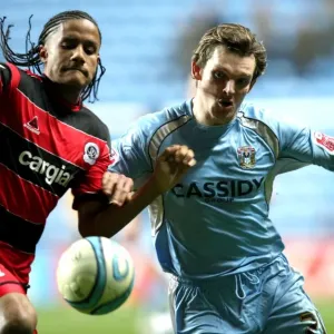 Competing for the Championship: A Battle Between Coventry City's Jay Tabb and Queens Park Rangers Michael Mancienne (Ricoh Arena, 2008) Competing for the Championship: A Battle Between Coventry City's Jay Tabb and Queens Park Rangers Michael Mancienne (Ricoh Arena, 2008)