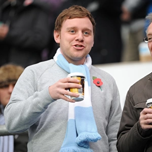 Coventry City Football Club: A Cozy Npower Championship Moment - Fans Savoring Hot Drinks at Ricoh Arena