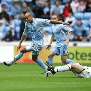 Coventry City vs Hull City: Leon Mackenzie Evades Ian Ashbee in Championship Clash at Ricoh Arena Coventry City vs Hull City: Leon Mackenzie Evades Ian Ashbee in Championship Clash at Ricoh Arena