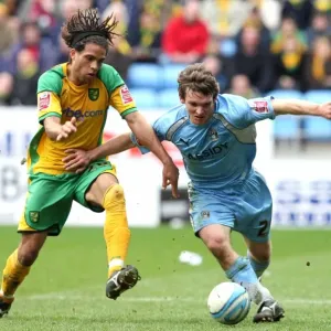 Coventry City vs. Norwich City: Championship Clash at Ricoh Arena - Tabb vs. Russell Battle for Ball Coventry City vs. Norwich City: Championship Clash at Ricoh Arena - Tabb vs. Russell Battle for Ball