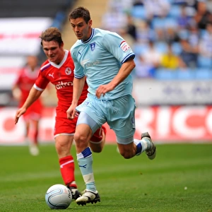 Coventry City vs Reading: Clash between Jutkiewicz and Tabb in Championship Action at Ricoh Arena