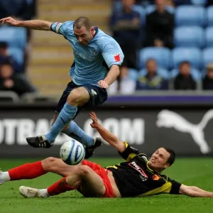 Coventry City vs. Watford: Battle for the Ball - Stephen Wright Leaps Clear of Don Cowie (Championship, 02-05-2010) Coventry City vs. Watford: Battle for the Ball - Stephen Wright Leaps Clear of Don Cowie (Championship, 02-05-2010)