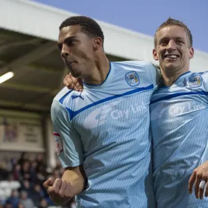 Coventry City's Glory: Franck Moussa and Carl Baker's Euphoric Celebration after Scoring the Third Goal vs Hartlepool United in Football League One Coventry City's Glory: Franck Moussa and Carl Baker's Euphoric Celebration after Scoring the Third Goal vs Hartlepool United in Football League One