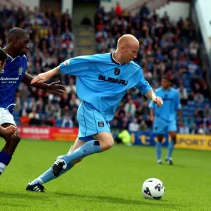 Coventry City's Lee Hughes: Fending Off Stockport Defenders Amidst Division One Momentum (11-08-2001) Coventry City's Lee Hughes: Fending Off Stockport Defenders Amidst Division One Momentum (11-08-2001)