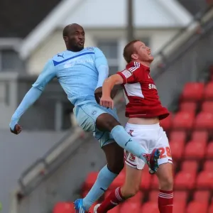 Coventry City's Nathan Cameron Outjumps Swindon Town's Adam Rooney: A Head-to-Head Battle in Npower League One Coventry City's Nathan Cameron Outjumps Swindon Town's Adam Rooney: A Head-to-Head Battle in Npower League One